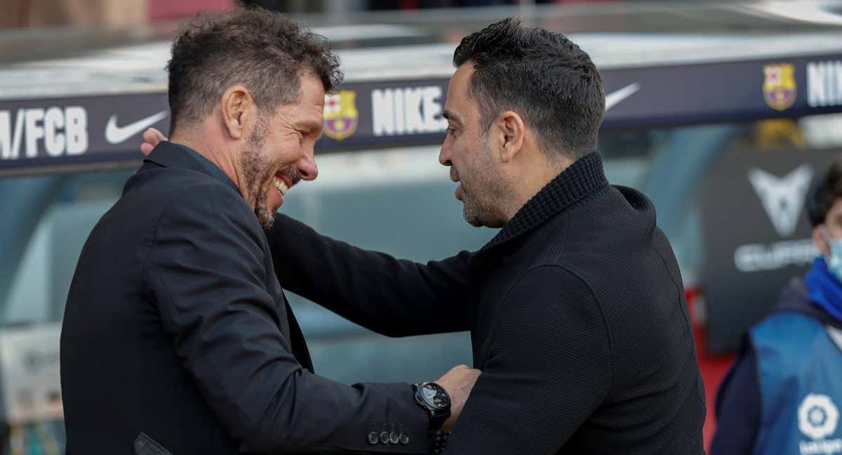Xavi y Simeone, durante la temporada pasada