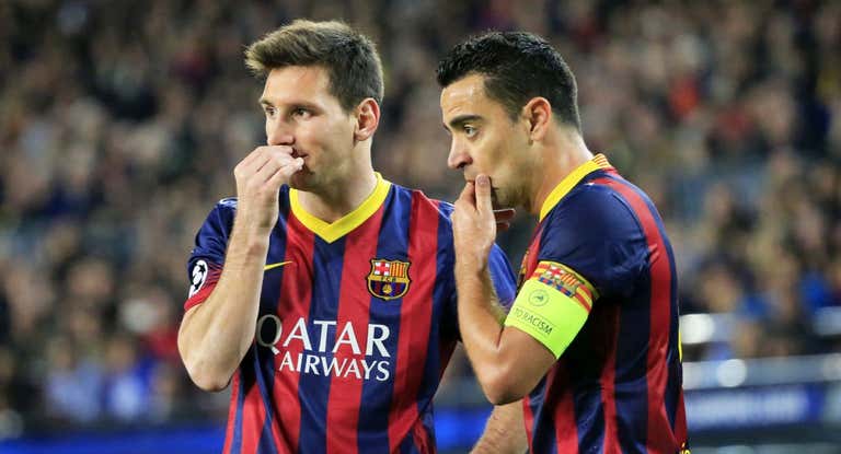 Leo Messi y Xavi durante un partido de Champions con el Barça.