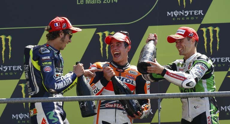 Valentino Rossi, Marc Márquez y Álvaro Bautista, en el podio del GP de Francia 2014.
