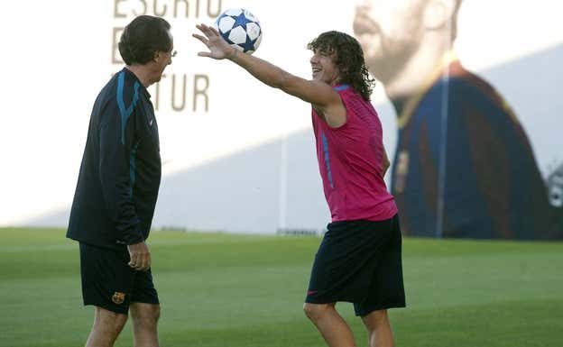Seirul·lo con Puyol durante un entrenamiento. AGENCIAS