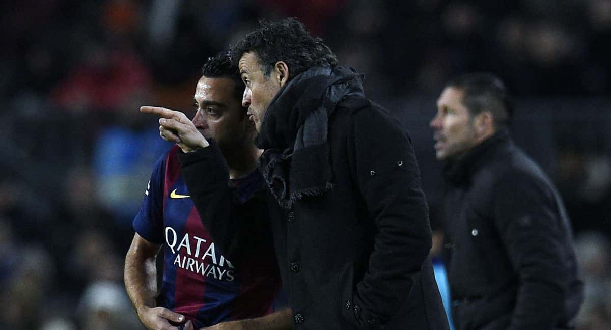 Luis Enrique y Xavi en su etapa como técnico y jugador en el Barcelona.
