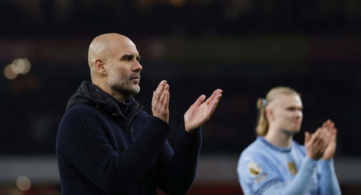 Pep Guardiola junto a Haaland. /REUTERS