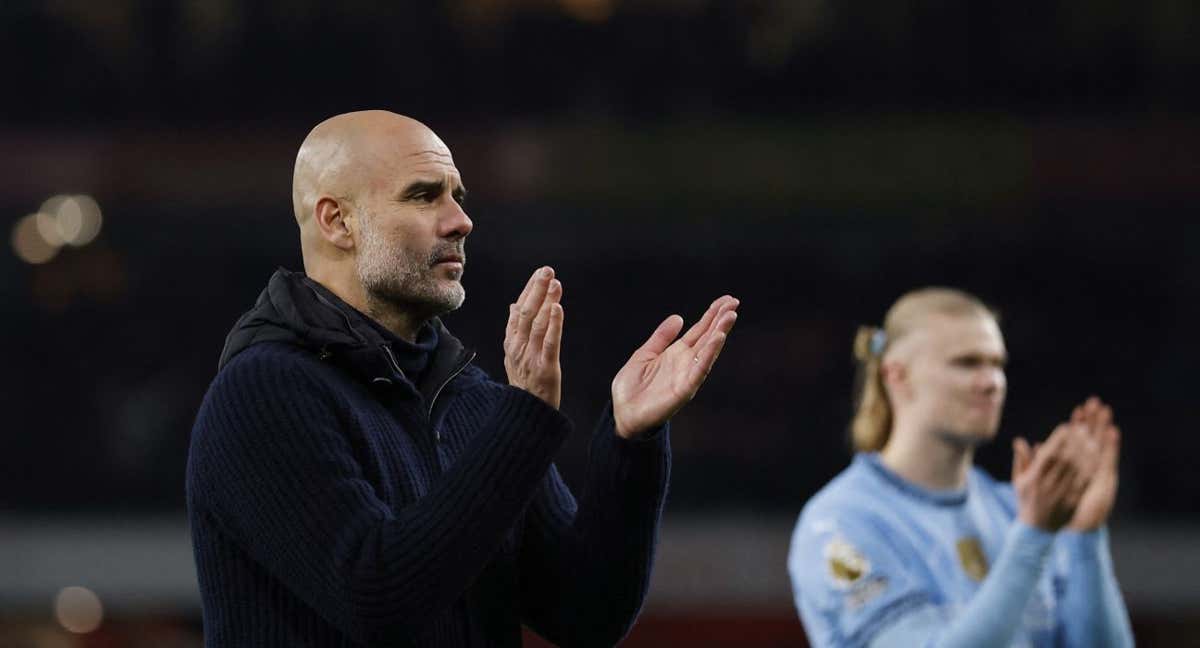 Pep Guardiola junto a Haaland.